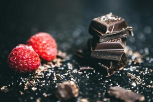 taken from pexels: https://www.pexels.com/photo/close-up-photo-of-stacked-chocolates-bars-beside-raspberries-918327/